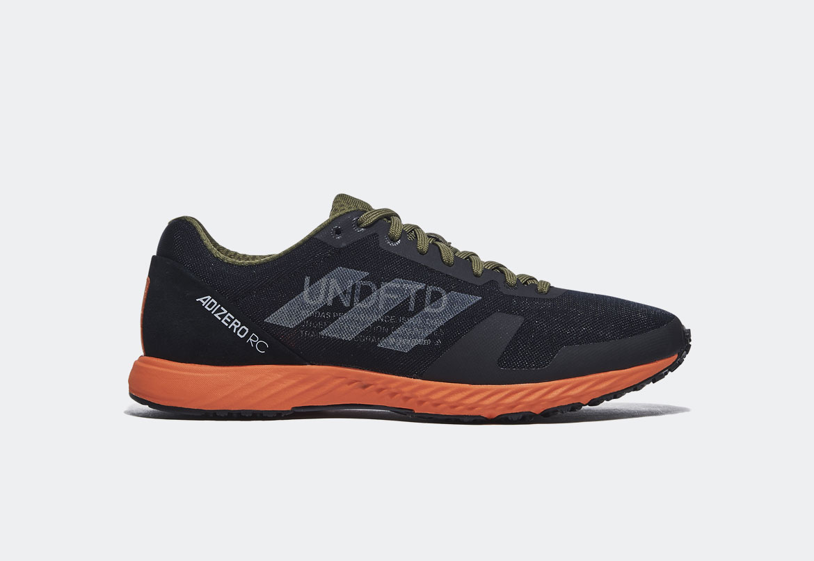 adidas x Undefeated — Adizero RC — tenisky — černé, oranžové